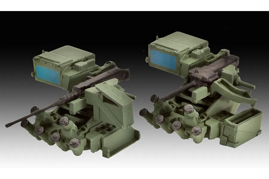 Two views of a 1/35 scale plastic model remote weapon station assembly, painted in olive green with a black machine gun.
