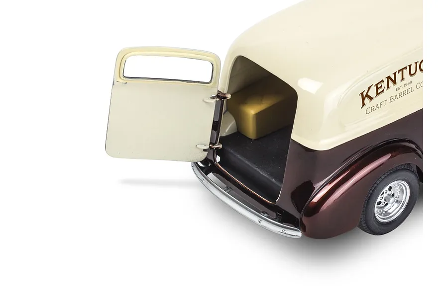 Rear view of a 1/24 scale 1939 Chevy Sedan Delivery model car with the rear door open, showing a two-tone cream and brown paint scheme.
