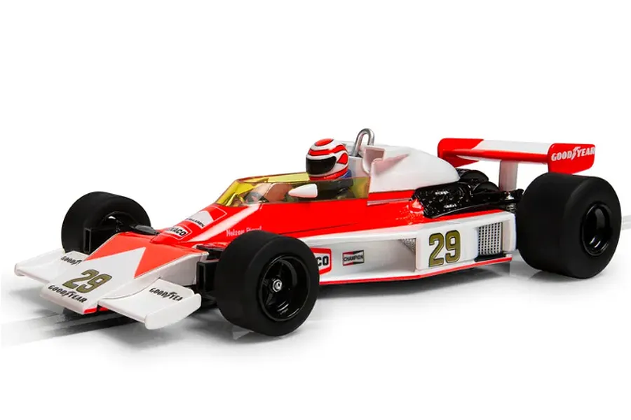 A 1/32 scale Scalextric McLaren M23 slot car in red and white livery with number 29, featuring a driver figure and Goodyear branding.