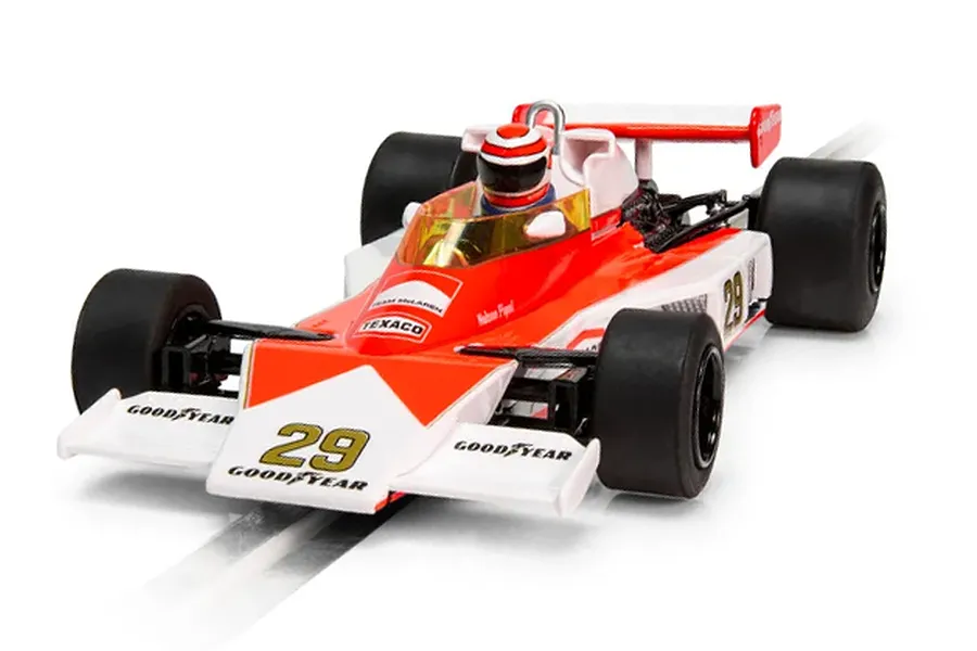 A 1/32 scale Scalextric McLaren M23 slot car in red and white livery with number 29, featuring Goodyear branding and a driver figure.