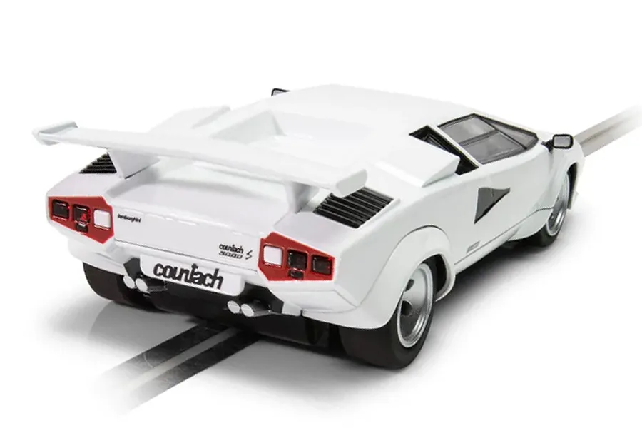 Rear three-quarter view of a white Scalextric 1/32 scale Lamborghini Countach slot car on a track.
