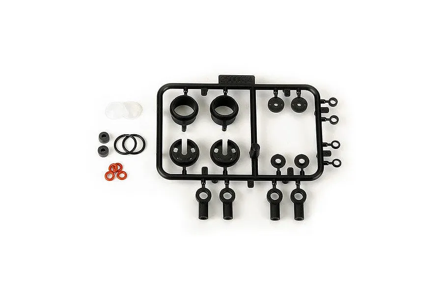 Pro-Line PowerStroke shock rebuild kit parts including a plastic parts tree, O-rings, and spacers on a white background.