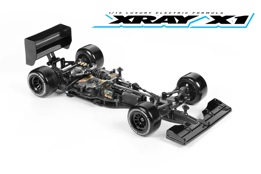 A high-angle studio shot of an assembled XRAY X1 1/10 scale electric formula RC car kit on a white background.