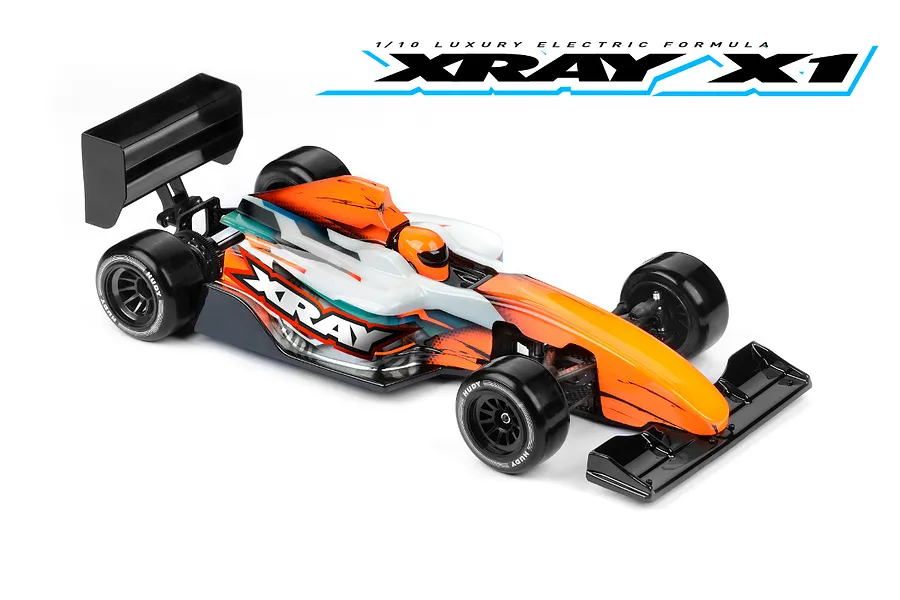 XRAY 1/10 scale X1 electric formula RC car with orange, white, and black bodywork, featuring a driver figure and black wheels on a white background.
