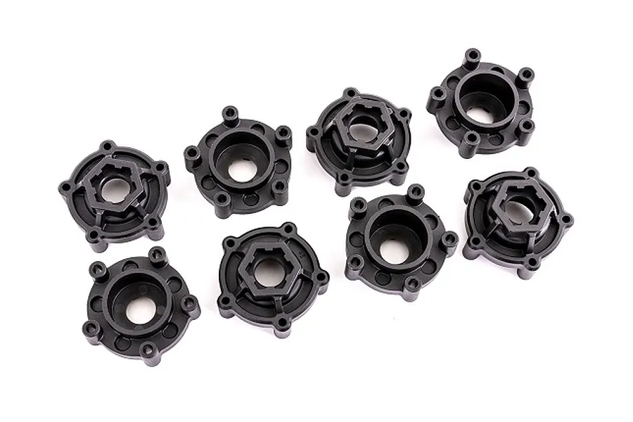A set of eight black plastic Traxxas wheel hub adapters arranged on a white background.