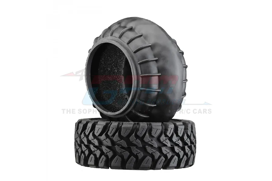 Two black rubber RC crawler tires stacked on a white background, showing tread patterns and internal foam inserts.
