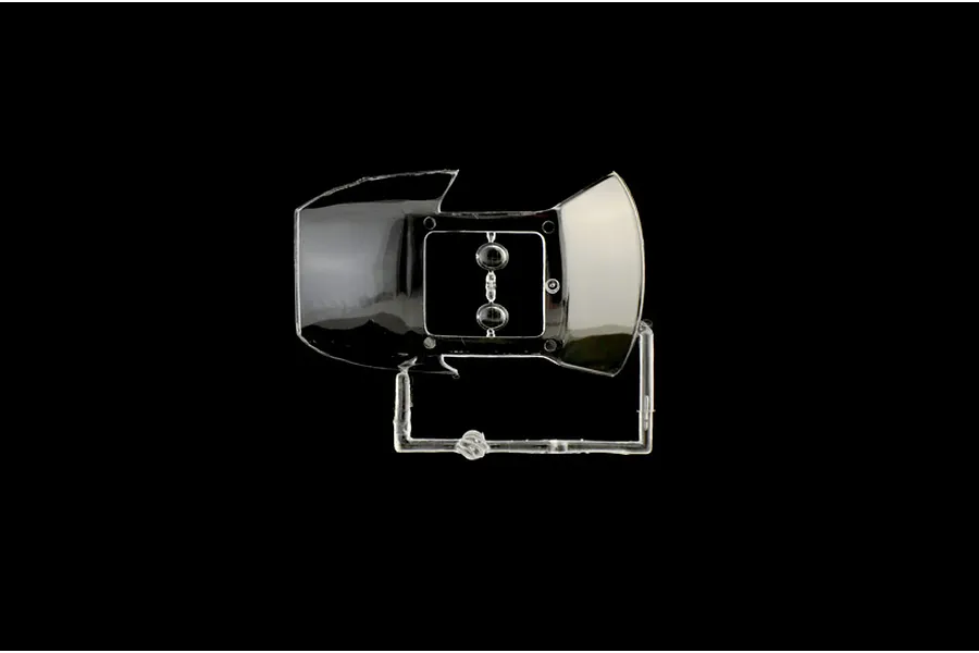 A clear plastic sprue containing a windshield and two small circular lenses for an Italeri 1/24 scale model kit.