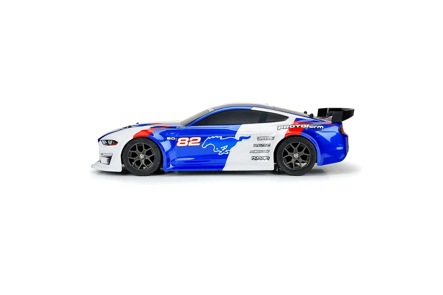 Side profile of a blue, white, and red pre-painted Protoform 1/8 2021 Ford Mustang RC body shell mounted on a chassis.