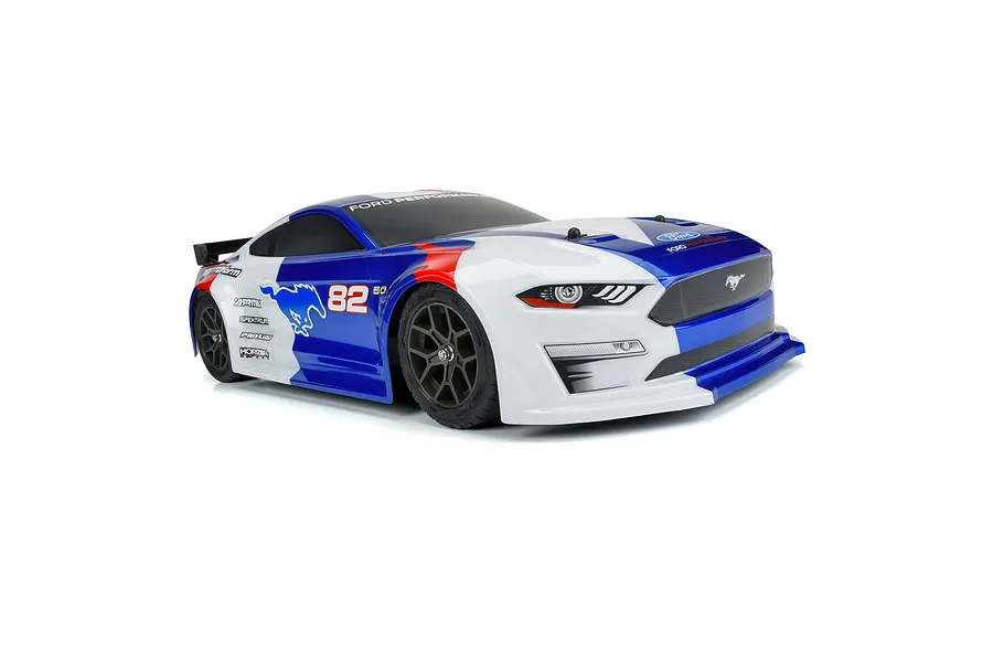 A pre-painted Protoform 1/8 2021 Ford Mustang RC body shell in blue, white, and red livery with racing decals, mounted on a chassis.