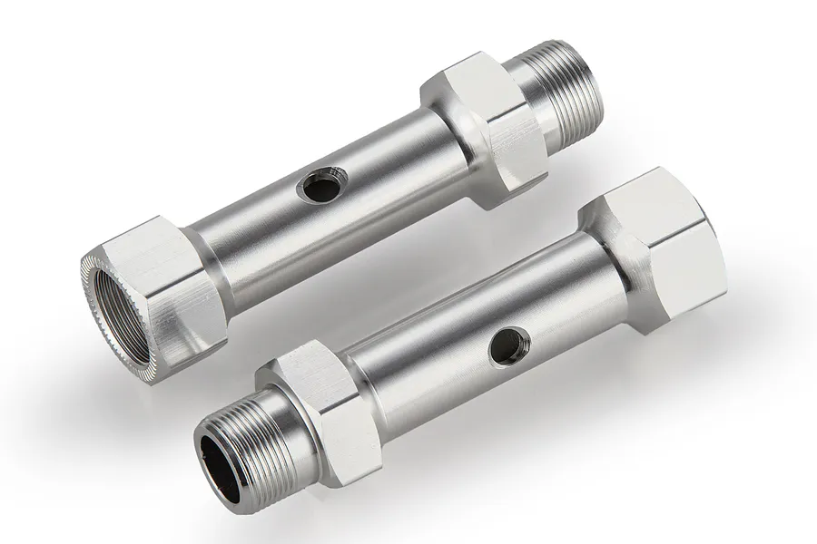 Two silver aluminium rear double axles for RC cars, shown from an angled perspective against a white background.