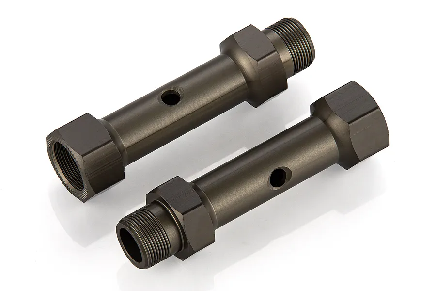 Two gunmetal grey aluminium rear double axles for RC vehicles, shown from an angled perspective on a white background.