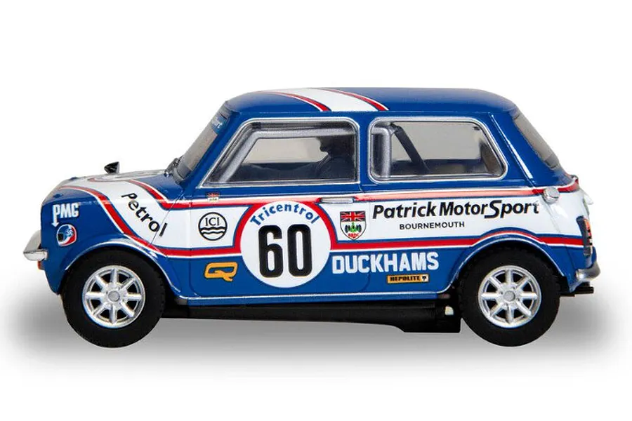 Side view of a blue and white Scalextric 1/32 scale Mini 1275GT slot car, number 60, featuring Patrick Motorsport livery.