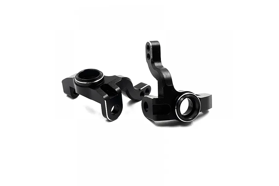 Two black aluminium RC steering hubs with silver chamfered edges, shown from a side angle against a white background.
