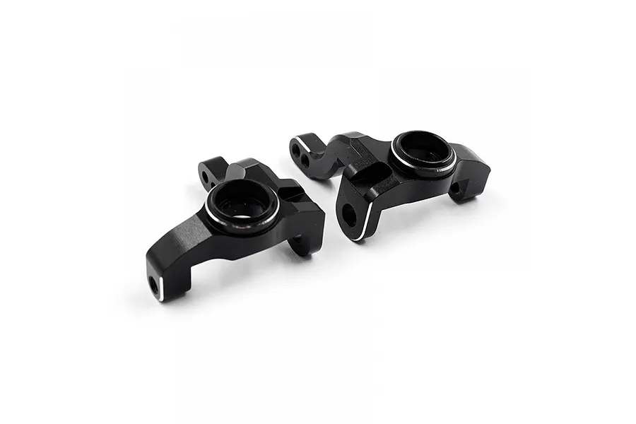 Two black anodized aluminium RC steering hubs from Yeah Racing, shown from an angled perspective against a white background.