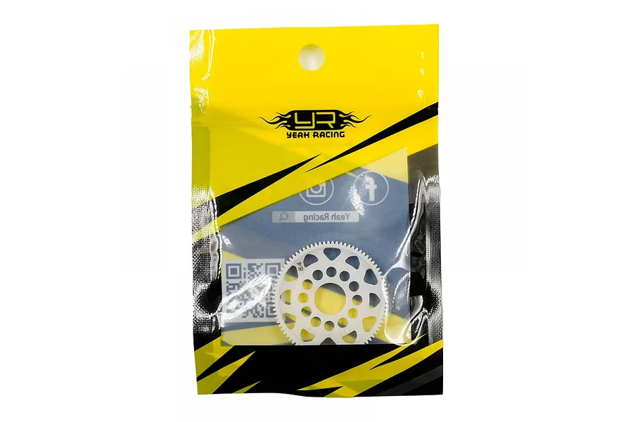 A white Delrin 84T spur gear in a yellow and black Yeah Racing branded plastic retail bag.