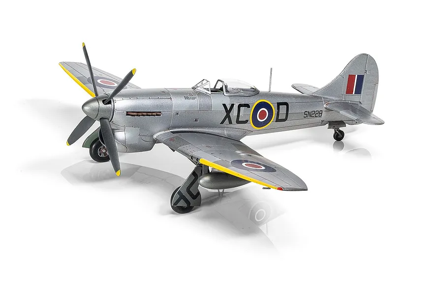 A fully assembled and painted 1/72 scale plastic model of a silver Hawker Tempest Mk.V fighter aircraft with RAF markings on a white background.
