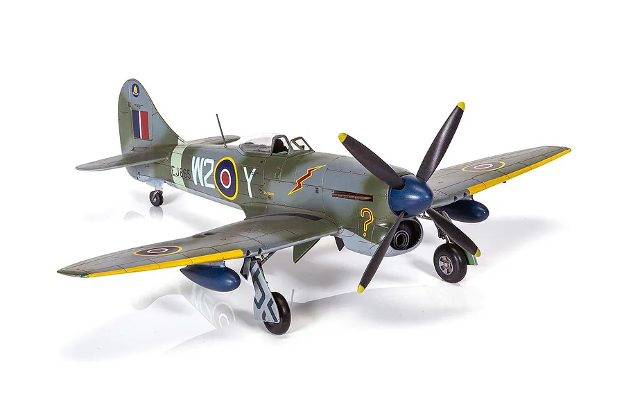 A fully assembled and painted 1/72 scale model of a Hawker Tempest Mk.V fighter plane, featuring camouflage paint and RAF markings.