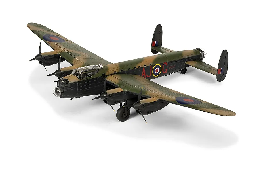 A completed 1/72 scale plastic model of an Avro Lancaster bomber in RAF camouflage, featuring AJ-G markings on the fuselage.