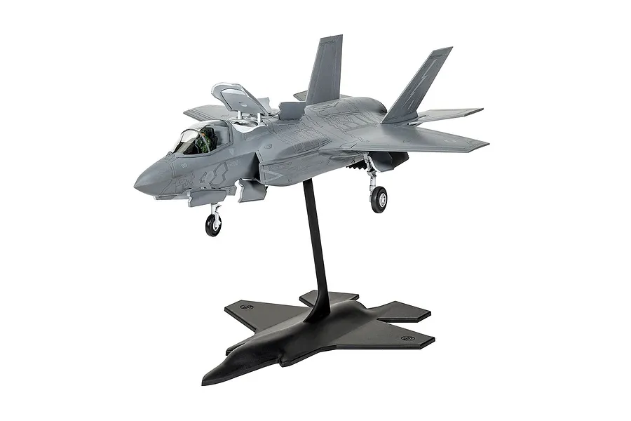 A fully assembled and painted 1/72 scale plastic model of a Lockheed Martin F-35B Lightning II jet fighter, mounted on a black display stand.