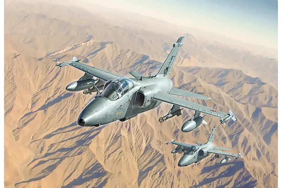 Box art illustration of two AMX Ghibli attack aircraft flying over a mountainous desert landscape.