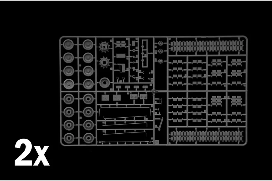 A grey plastic sprue from an Italeri 1/35 M1 A1 Abrams model kit, featuring tank road wheels, drive sprockets, and track segments, with a 2x label.