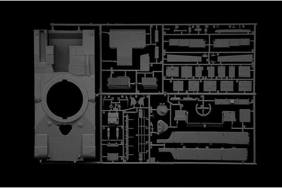 A grey plastic sprue containing various parts for an Italeri 1/35 scale M1 A1 Abrams tank model kit, including the main hull piece.