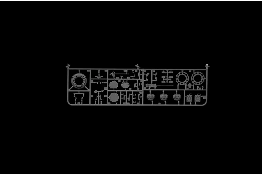 A grey plastic sprue containing various small parts for an Italeri 1/35 scale M1 A1 Abrams tank model kit, set against a black background.