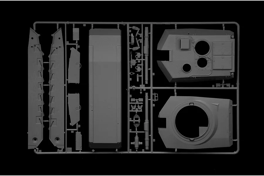 A grey plastic sprue from an Italeri 1/35 scale M1A1 Abrams model kit, showing tank hull and turret components against a black background.