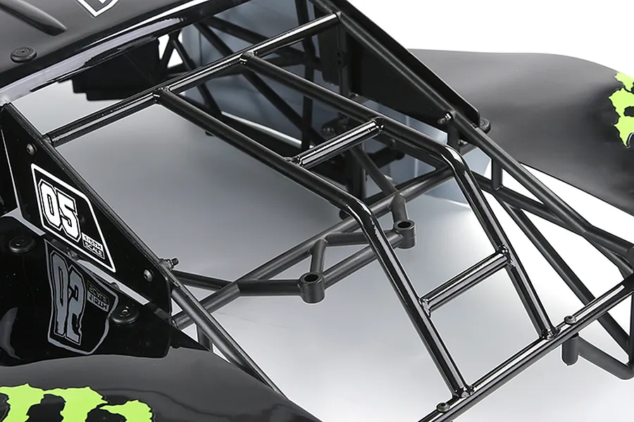 Close-up of a black Rovan 1/5 scale RC short course truck body shell featuring a black roll cage and green graphic accents.