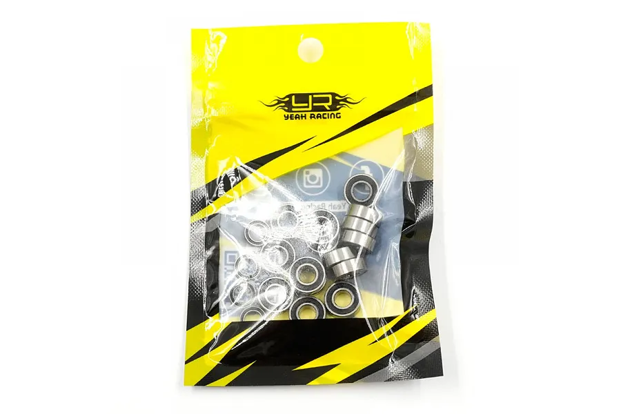 A pack of Yeah Racing rubber shielded ball bearings in a yellow and black branded plastic bag.