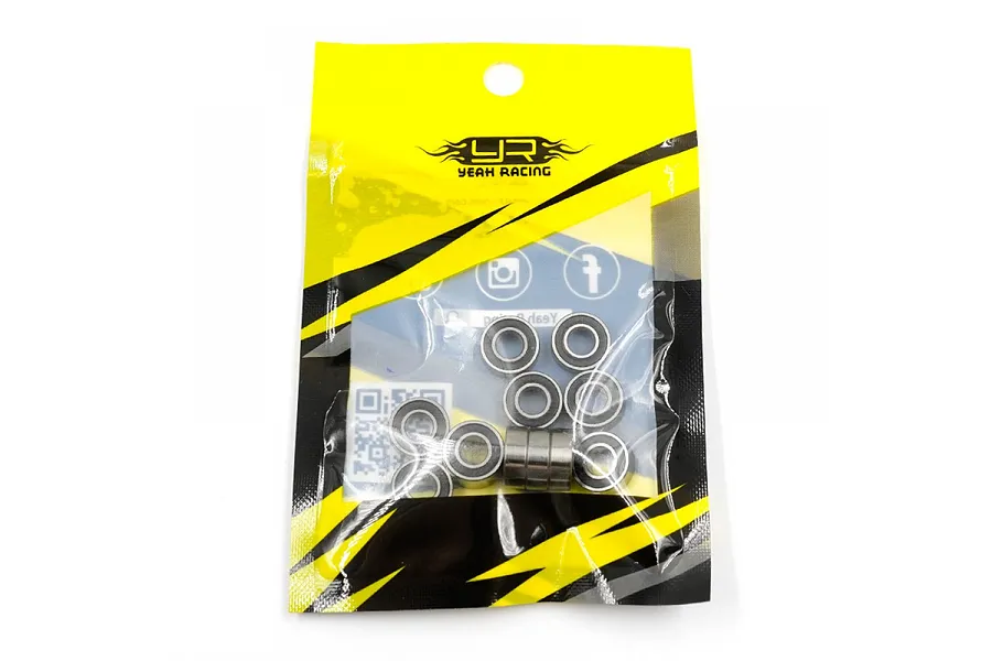 A sealed plastic bag containing a set of small metal ball bearings from Yeah Racing, featuring yellow and black branding.