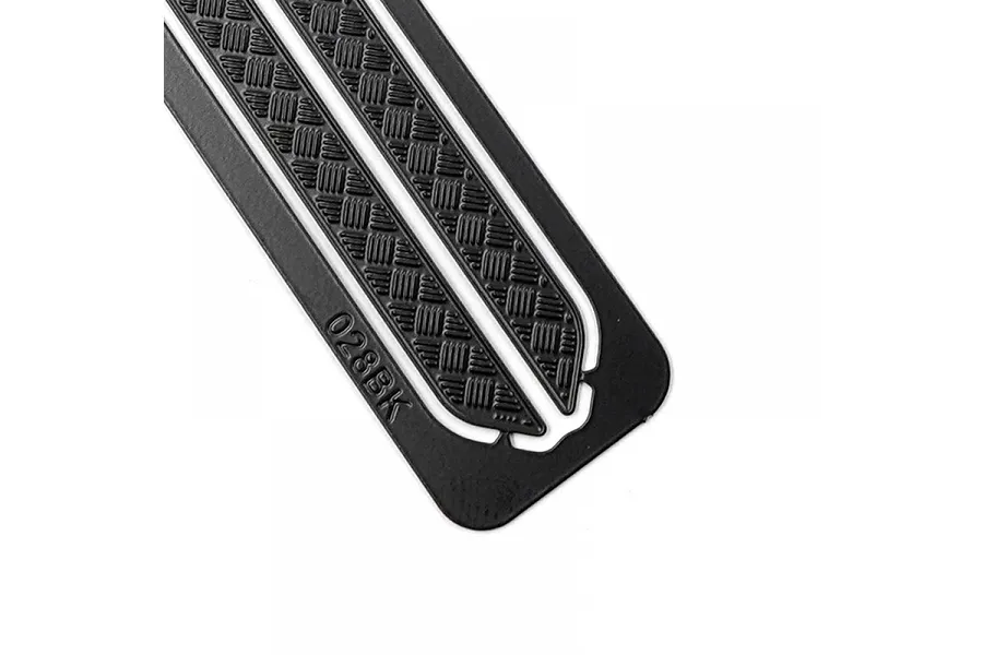 Close-up of a black stainless steel diamond plate rock rail for an RC car, showing the textured surface and the engraved part number 028BK.