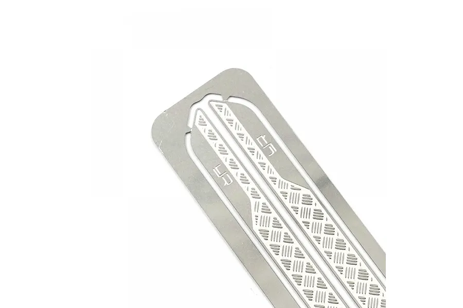 Close-up of a silver stainless steel diamond plate rock rail for an RC car, featuring the Yeah Racing logo.
