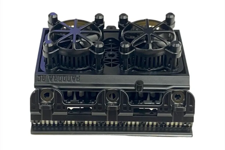 A black plastic 1/10 scale radiator assembly accessory by Pandora RC featuring dual cooling fans.