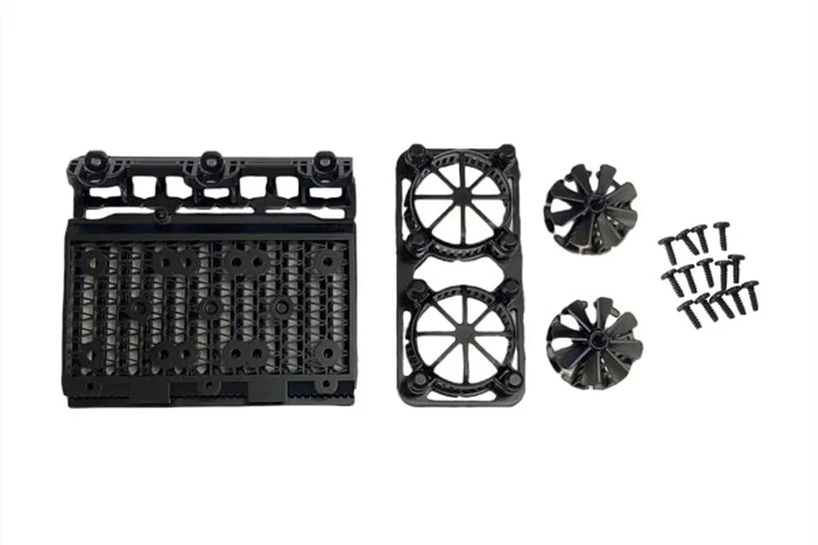 Pandora RC 1/10 scale radiator assembly accessory kit including radiator core, dual fan shroud, two fan blades, and mounting screws.
