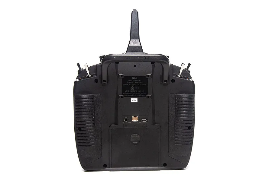 Rear view of the Spektrum NX8 RC transmitter showing the antenna, handle, battery compartment, and various ports against a white background.