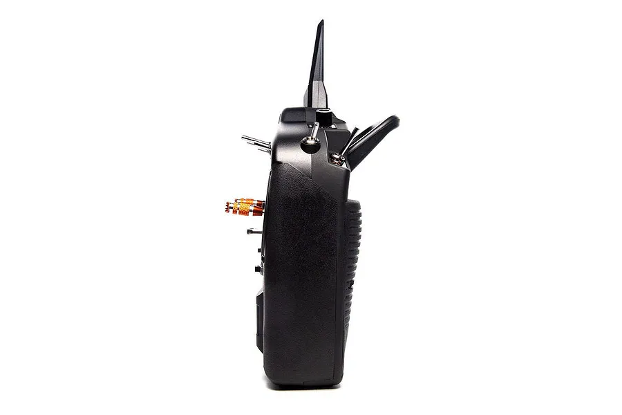 Side profile view of a black Spektrum NX8 RC transmitter showing switches, antenna, and orange adjustment knobs.