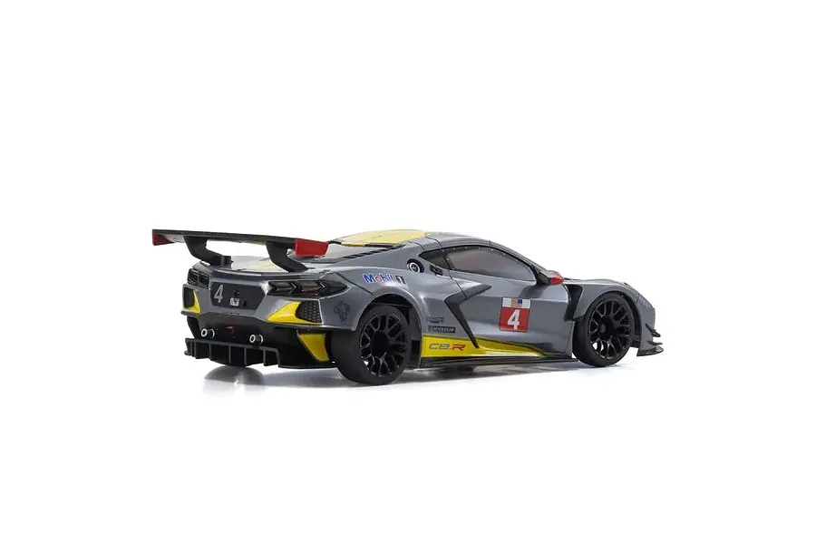 A rear three-quarter view of a Kyosho Mini-Z Chevrolet Corvette C8.R RC car body shell in gunmetal grey with racing decals.