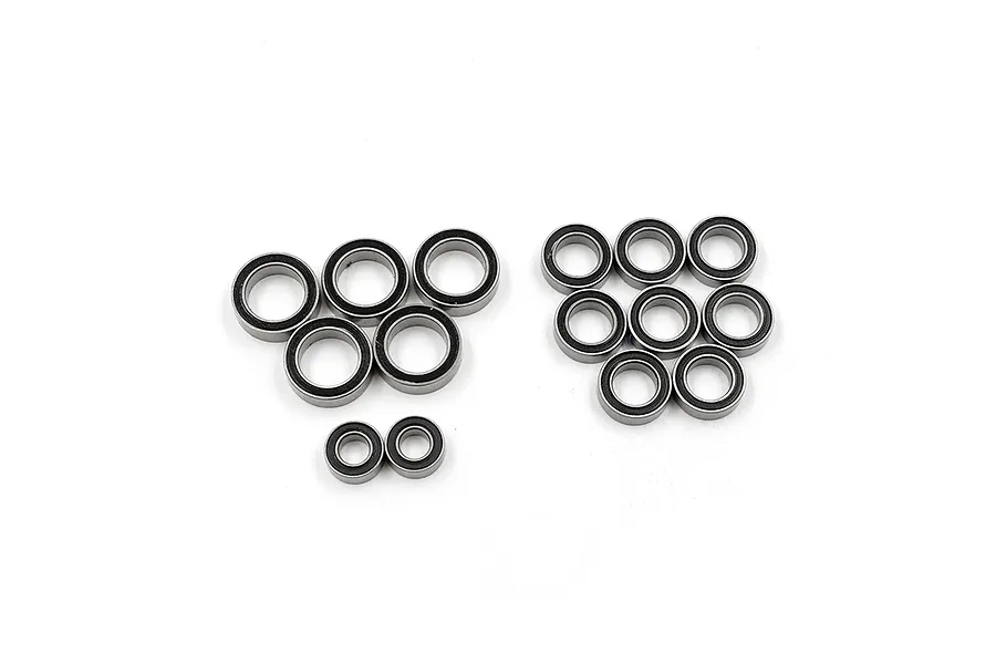 A collection of various sized rubber shielded ball bearings arranged on a white background.
