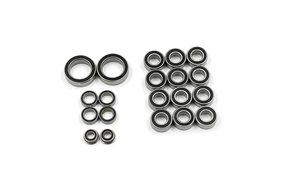 A collection of various sized rubber shielded ball bearings for RC cars arranged on a white background.