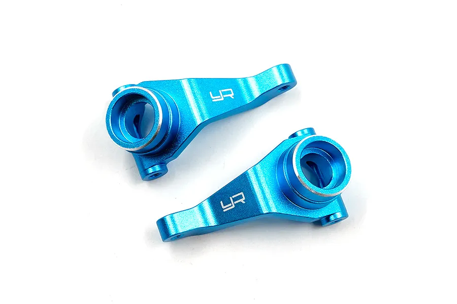 Two blue anodized aluminium RC front steering hubs with the Yeah Racing logo engraved on the surface.
