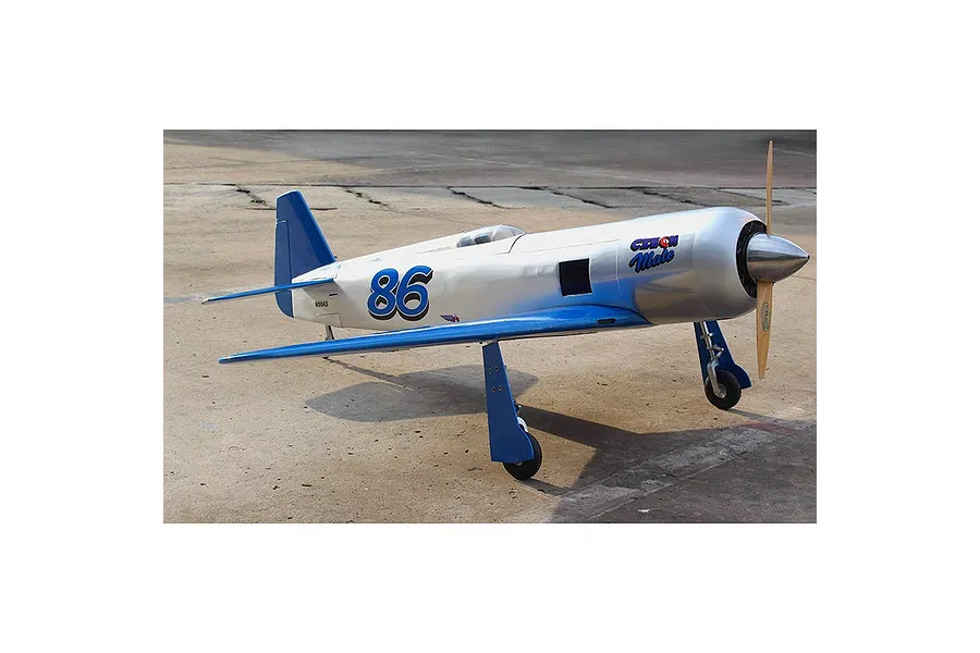A Seagull RC Reno Yak 11 Czech Mate warbird model plane in silver and blue livery sitting on a concrete runway.