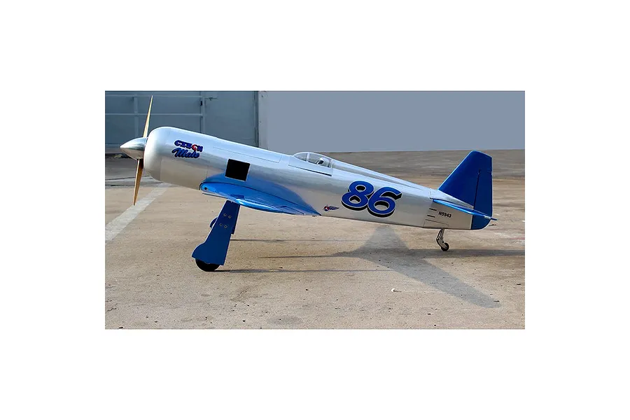 A side view of the Seagull RC Reno Yak 11 model plane in silver and blue livery with the number 86 on the fuselage.