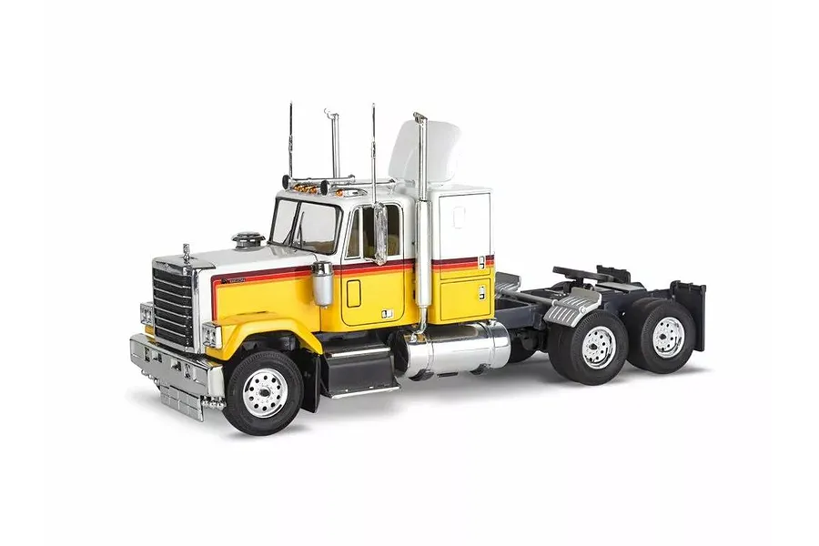 A 1/32 scale model of a 1978 Chevy Bison semi-truck, featuring a yellow and white cab with red stripes, chrome exhaust stacks, and black wheels.