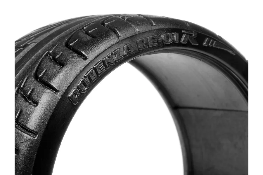 Close-up of a black HPI Potenza RE-01R RC drift tyre showing the moulded sidewall branding and tread pattern.
