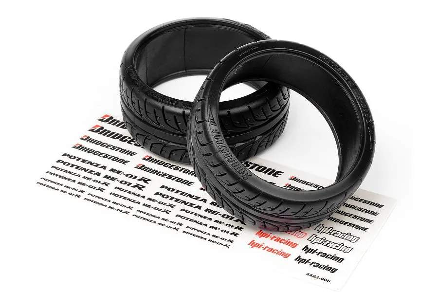Two black HPI Racing drift tyres with Bridgestone Potenza RE-01R branding, sitting on a decal sheet against a white background.