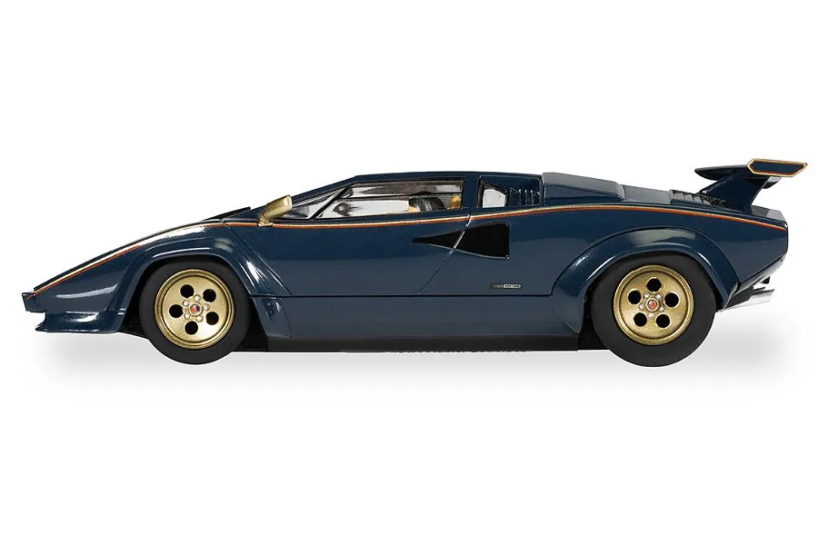 Side profile of a blue and gold Scalextric Lamborghini Countach 1/32 scale slot car on a white background.
