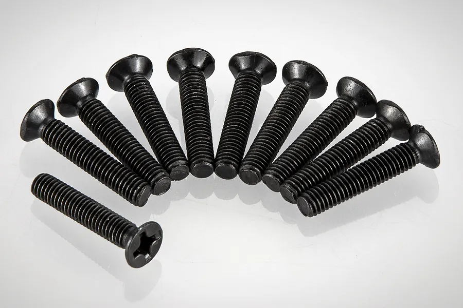 A set of ten black metal countersunk screws arranged in a semi-circle on a white background.