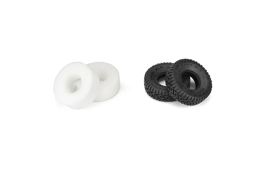 Two black Pro-Line 1.9 inch Toyo Open Country R/T RC crawler tyres and two white foam inserts on a white background.