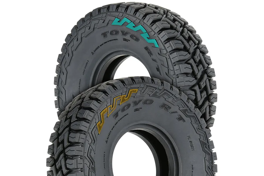 Two Pro-Line 1.9 inch Toyo Open Country R/T rock crawler tyres with detailed tread patterns and coloured sidewall lettering.